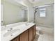 Bright bathroom featuring a double sink vanity, toilet, and bathtub-shower combination for convenience at 297 Beacon Pointe Dr, Ocoee, FL 34761