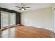 Bedroom with hardwood floors and access to a private balcony at 297 Beacon Pointe Dr, Ocoee, FL 34761