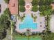Aerial view of the community pool area including a star-shaped splash pad and several lounge chairs at 297 Beacon Pointe Dr, Ocoee, FL 34761