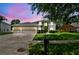 Charming home with a three-car garage, manicured lawn, and mature trees in a well-kept neighborhood at 297 Beacon Pointe Dr, Ocoee, FL 34761
