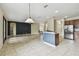Expansive living area with tile flooring, connecting to the kitchen and other rooms at 297 Beacon Pointe Dr, Ocoee, FL 34761