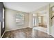 Bright living room with hardwood floors, large windows, and a neutral color palette at 297 Beacon Pointe Dr, Ocoee, FL 34761