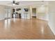Open living area with hardwood floors, kitchenette, and access to balcony at 297 Beacon Pointe Dr, Ocoee, FL 34761