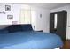 Bedroom with large bed, side table, and wardrobe providing ample storage in a relaxing setting at 5 Moonlight Ln, Winter Haven, FL 33884