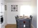 Bright dining area featuring a table with seating for four, decor, and natural light at 5 Moonlight Ln, Winter Haven, FL 33884