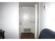 Hallway with neutral paint, tile flooring, and white trim at 5 Moonlight Ln, Winter Haven, FL 33884