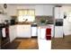Bright kitchen featuring white cabinets, stainless steel appliances, granite countertops, and a stylish backsplash at 5 Moonlight Ln, Winter Haven, FL 33884