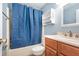 Cozy bathroom with a bathtub, shower, vanity, and storage shelf at 89 Fremont Ave # 504, Daytona Beach, FL 32114