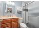 Bathroom featuring a vanity, toilet, and tiled walk-in shower at 89 Fremont Ave # 504, Daytona Beach, FL 32114
