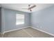 Bedroom with a ceiling fan and window at 89 Fremont Ave # 504, Daytona Beach, FL 32114