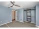 Bedroom featuring a ceiling fan, terrazzo flooring, and closet with shelving at 89 Fremont Ave # 504, Daytona Beach, FL 32114
