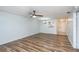 Open living space featuring wood-look flooring, contemporary ceiling fan and kitchen passthrough at 89 Fremont Ave # 504, Daytona Beach, FL 32114