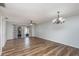 Open-concept room with wood-look flooring, a chandelier, and sliding doors to a patio at 89 Fremont Ave # 504, Daytona Beach, FL 32114
