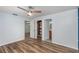 Spacious bedroom with hardwood floors, ceiling fan and ensuite bath at 89 Fremont Ave # 504, Daytona Beach, FL 32114