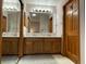 Spacious bathroom featuring a double sink vanity, a large mirror, and a well-lit area for grooming at 508 Alcazar Ct, Lady Lake, FL 32159