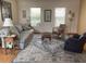 Relaxing living room featuring comfortable seating, natural light, and cozy decor at 508 Alcazar Ct, Lady Lake, FL 32159
