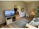 Inviting living room with an archway leading to the kitchen and comfortable seating for relaxing and entertaining at 508 Alcazar Ct, Lady Lake, FL 32159