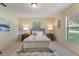 Comfortable bedroom featuring a plush bed, soft carpet, and ample natural light at 13449 Ashley Ct, Grand Island, FL 32735