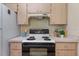 Kitchen featuring a white stove and laminate countertops that provide an easy to clean surface at 13449 Ashley Ct, Grand Island, FL 32735