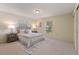 Serene main bedroom featuring a comfortable bed, neutral decor, and plenty of natural light at 13449 Ashley Ct, Grand Island, FL 32735