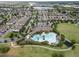 Overhead view of community clubhouse with pool, surrounded by lush landscaping and homes at 16324 Brisk Breeze Aly, Winter Garden, FL 34787