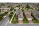 Aerial view of homes with solar panels, manicured lawns, brick driveways and sidewalks, in a well-planned neighborhood at 16324 Brisk Breeze Aly, Winter Garden, FL 34787