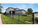Fenced backyard with lush green lawn and well-maintained landscaping at 16324 Brisk Breeze Aly, Winter Garden, FL 34787