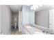 Bathroom featuring a double vanity with granite countertops at 16324 Brisk Breeze Aly, Winter Garden, FL 34787