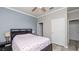 The bedroom shows wood-look flooring, base molding, and neutral walls at 16324 Brisk Breeze Aly, Winter Garden, FL 34787