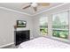 This bedroom boasts natural light and an airy feel and wood laminate floors at 16324 Brisk Breeze Aly, Winter Garden, FL 34787