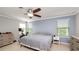 Cozy bedroom with a ceiling fan and lots of natural light at 16324 Brisk Breeze Aly, Winter Garden, FL 34787