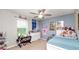 Bedroom featuring a ceiling fan and lots of toys and collectables at 16324 Brisk Breeze Aly, Winter Garden, FL 34787