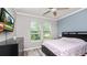 This bedroom boasts natural light and an airy feel and wood laminate floors at 16324 Brisk Breeze Aly, Winter Garden, FL 34787