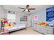 Cozy bedroom with a ceiling fan at 16324 Brisk Breeze Aly, Winter Garden, FL 34787
