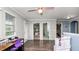 Bright bonus room with hardwood floors, natural light, and easy access to other areas of the home at 16324 Brisk Breeze Aly, Winter Garden, FL 34787