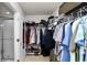 Spacious walk-in closet with shelving and hanging storage, with bathroom access at 16324 Brisk Breeze Aly, Winter Garden, FL 34787