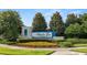 Welcome to Atwater Bay Waterleigh, sign with lush landscaping and colorful flowers at 16324 Brisk Breeze Aly, Winter Garden, FL 34787