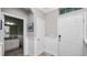The entryway showcases tiled floors, paneled walls, and a door to the powder room at 16324 Brisk Breeze Aly, Winter Garden, FL 34787