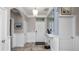 This is an entryway that features paneled walls, tiled flooring, and a pendant light at 16324 Brisk Breeze Aly, Winter Garden, FL 34787