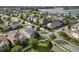 Beautiful community featuring well-maintained homes, lush green lawns, and solar panels, near a serene lake at 16324 Brisk Breeze Aly, Winter Garden, FL 34787