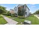 Charming two-story home with a screened porch and beautifully landscaped front yard on a corner lot at 16324 Brisk Breeze Aly, Winter Garden, FL 34787