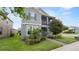Charming two-story home featuring a screened porch, well-manicured lawn, and mature landscaping at 16324 Brisk Breeze Aly, Winter Garden, FL 34787
