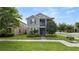 Charming two-story home with screened porch, lush lawn, tasteful landscaping and a brick walkway at 16324 Brisk Breeze Aly, Winter Garden, FL 34787