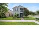 Beautiful two-story home with a screened porch, lush lawn, and tasteful landscaping at 16324 Brisk Breeze Aly, Winter Garden, FL 34787