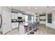 Bright kitchen with stainless appliances, large island with bar stools and granite counters at 16324 Brisk Breeze Aly, Winter Garden, FL 34787