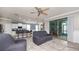 Spacious living area with bar seating, access to an outdoor patio, and open layout at 16324 Brisk Breeze Aly, Winter Garden, FL 34787
