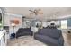Spacious open living room showing the tile floors with view to the kitchen and stairs to the second floor at 16324 Brisk Breeze Aly, Winter Garden, FL 34787