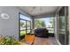Bright, screened patio with brick pavers, seating, and backyard views at 16324 Brisk Breeze Aly, Winter Garden, FL 34787