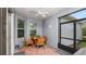 Enjoy this screened patio with a ceiling fan, windows, and a dining table for four at 16324 Brisk Breeze Aly, Winter Garden, FL 34787