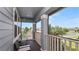 Cozy screened-in patio with two black chairs to sit and relax in the fresh air at 16324 Brisk Breeze Aly, Winter Garden, FL 34787